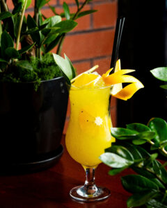 citrus cocktail decorated with orange peel